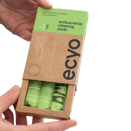 ecyo cleaning pods x 3 - antibacterial - someone holding open box