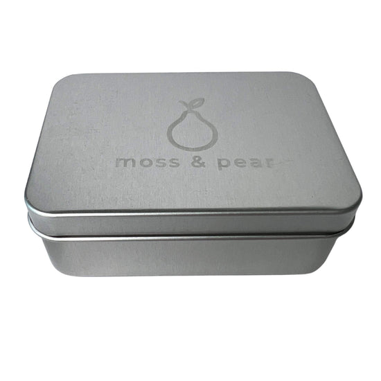 moss & pear aluminium travel soap tin with detachable draining tray. Brushed silver with logo on lid